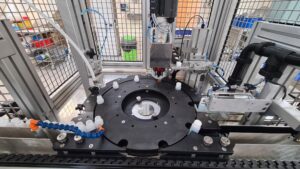 CC560 Cap Closure machine semi automatic, ATEX rated to Zone 2. Black Anti Static Plastics, Metal Grid Guarding, Positive Pressure Electrical Cabinet.