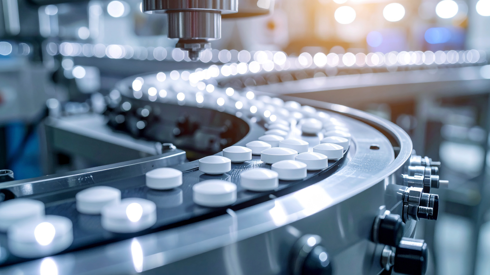 Operators overseeing pharmaceutical capping process on automated production line.