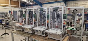 CC1100 Semi-Automatic Benchtop Capper in a clean manufacturing workspace for small-scale production.