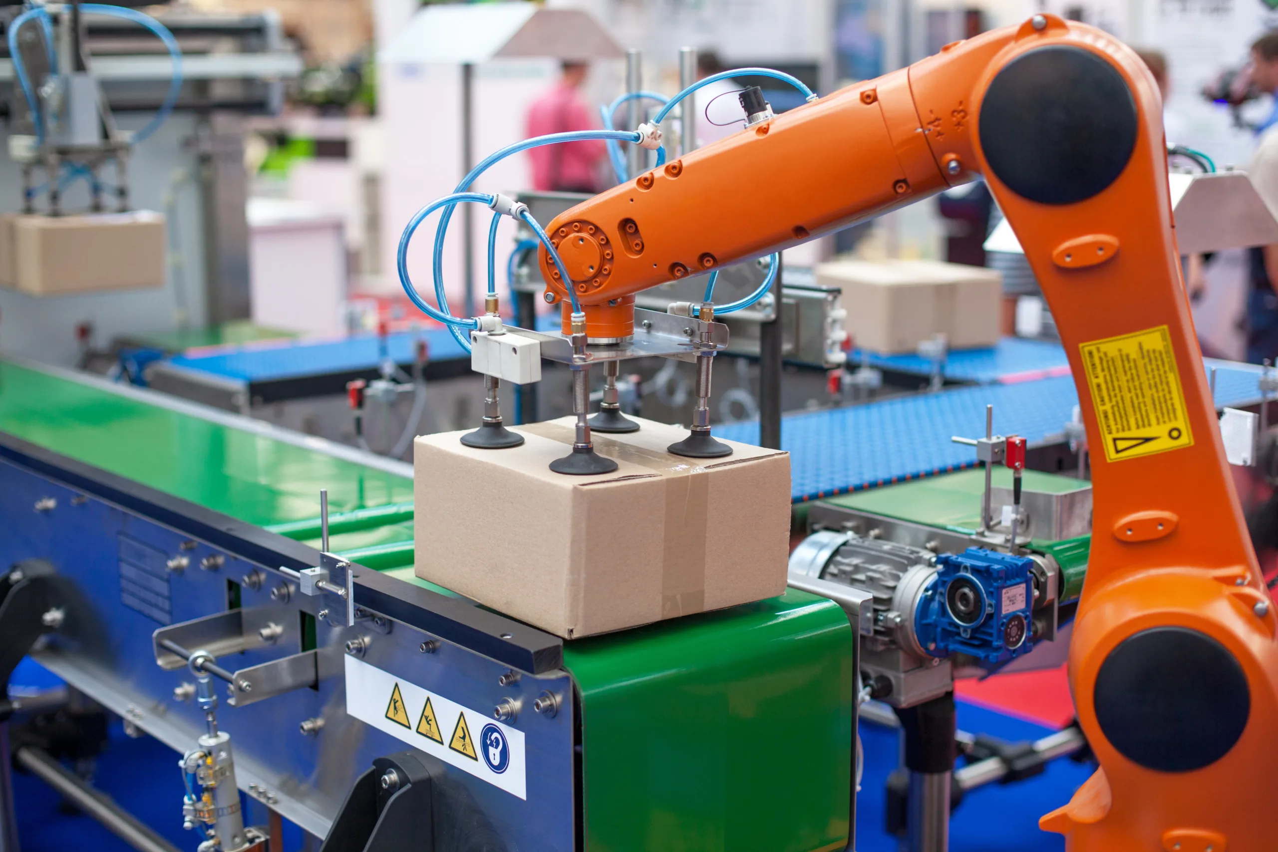 Robotic arm automating picking and placing tasks on a production line.