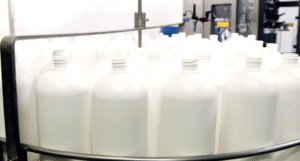 CC570 Filling Machine Loading Table, showing bottles already loaded.
